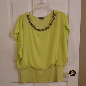 Yellow (not bright) blouse.